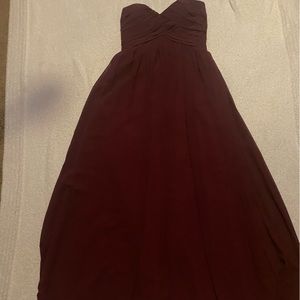 Long burgundy/maroon dress, strapless.